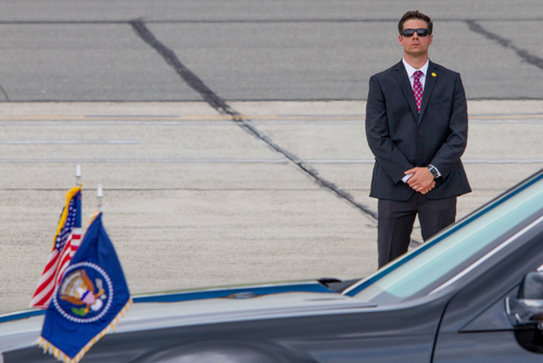 Secret-Service-Agent-Small - Criminal Justice Programs Secret Service Agent Standing by the Presidential State Car