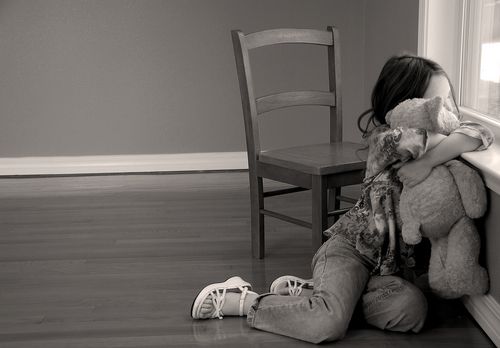 Little Girl Hugging Her Teddy Bear