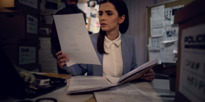 Female officer reviewing police documents