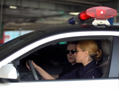 Two police officers driving in a car